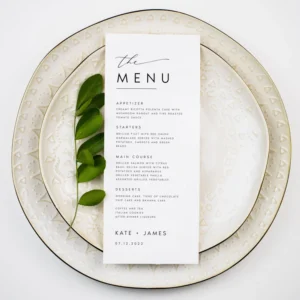 Elegant wedding menu card with floral accents and cursive lettering