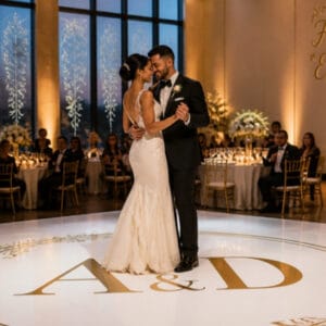 Custom monogram dance floor decal and window decals at a wedding reception