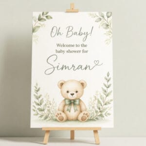 Baby shower welcome sign with teddy bear on easel