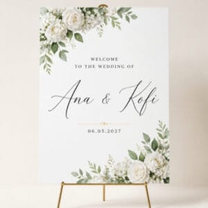 Wedding welcome sign with white florals on gold easel