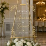 Clear acrylic wedding welcome sign on gold easel