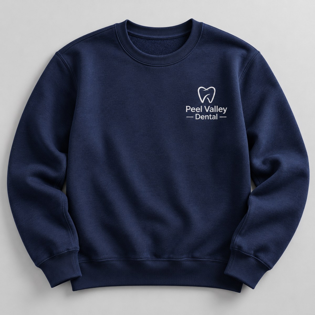 Custom navy crewneck sweatshirt with an embroidered left chest business logo