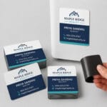 Custom printed magnetic business cards on a fridge