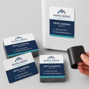 Custom printed magnetic business cards on a fridge