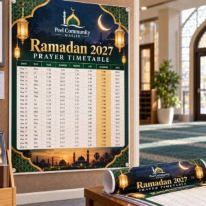 Printed Ramadan prayer timetable poster on a mosque notice board